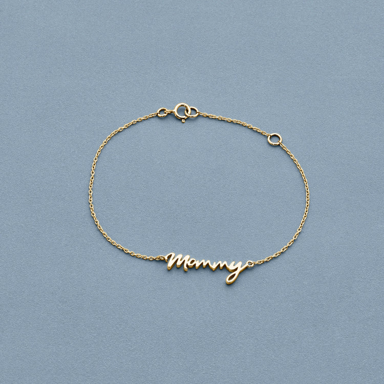 Stone and Strand 14K Yellow Gold Gold Best Mommy Bracelet Editorial Image