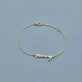 Stone and Strand 14K Yellow Gold Gold Best Mommy Bracelet Editorial Image