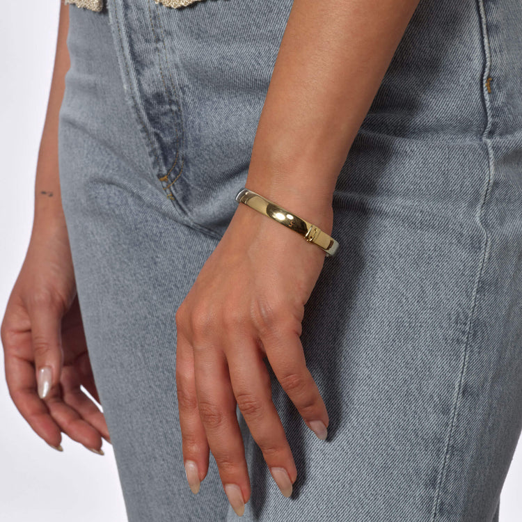 Image of 10K Yellow Gold Gold Cigar Bangle on Models Arm
