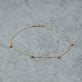Stone and Strand 10K Yellow Gold Gold Cluster Anklet Editorial Image