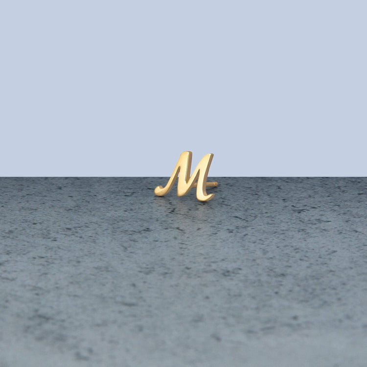 Stone and Strand 10K Yellow Gold Gold Cursive Initial Stud Editorial M Image