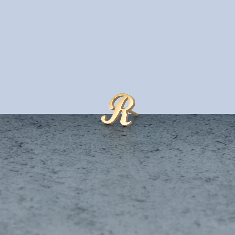 Stone and Strand 10K Yellow Gold Gold Cursive Initial Stud Editorial R Image