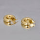 Stone and Strand 10K Yellow Gold Gold Doughnut Hoops Editorial Image