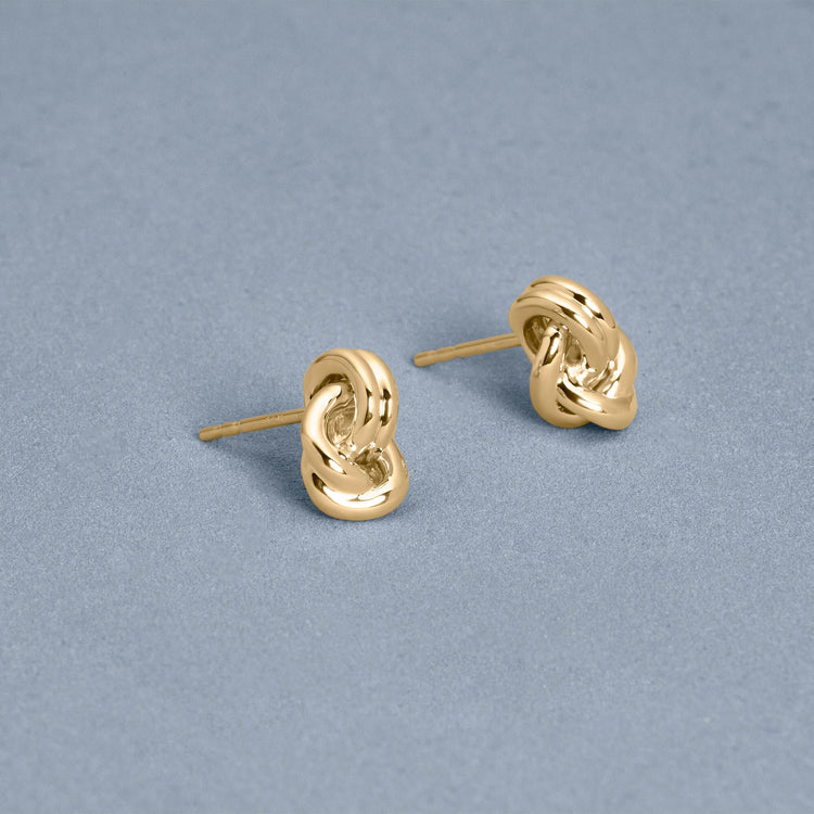 Stone and Strand 14K Yellow Gold Forme Dainty Knot Studs Editorial Image