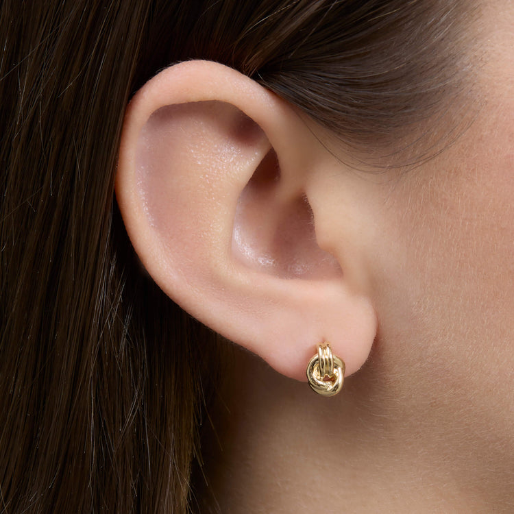 Image of 14K Yellow Gold Forme Dainty Knot Studs on Models Ear