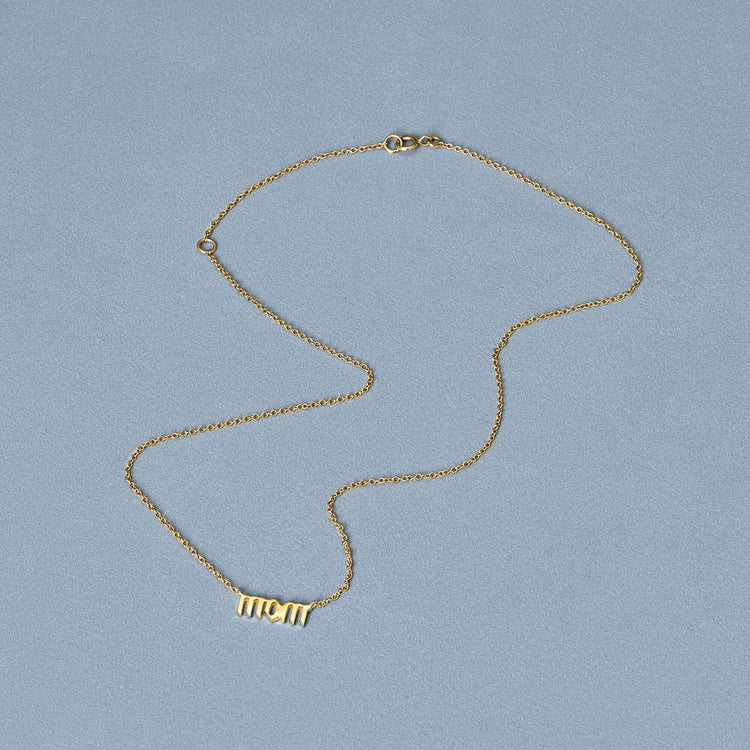 Stone and Strand 14K Yellow Gold Gold Gothic Mom Choker Necklace Editorial Image