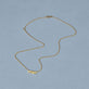 Stone and Strand 14K Yellow Gold Gold Gothic Mom Choker Necklace Editorial Image