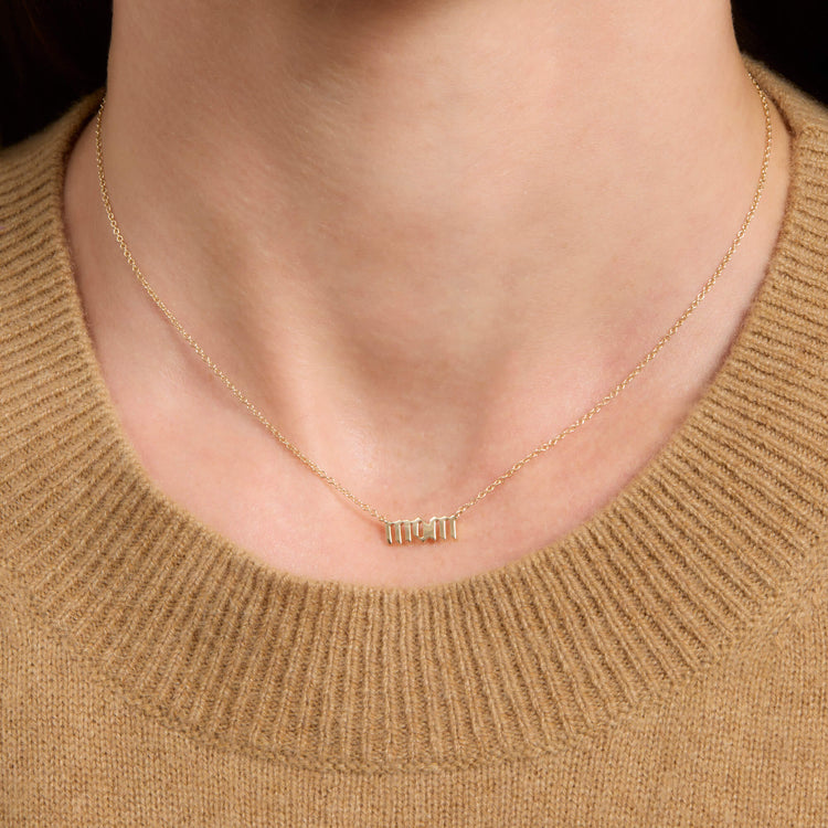 Image of 14K Yellow Gold Gold Gothic Mom Choker Necklace on Models Neck
