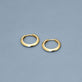 Stone and Strand 14K Yellow Gold Gold Knife Edge Single Huggie Editorial Image