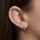 Image of 14K Yellow Gold Gold Knife Edge Single Huggie on Models Ear