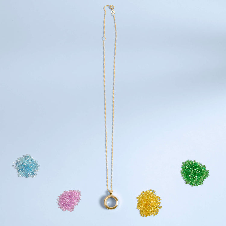 Stone and Strand 14K Yellow Gold Gold Memento Locket Necklace Editorial Image