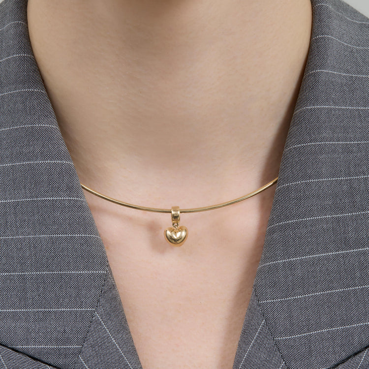 Image of 14K Yellow Gold Gold Puff Heart Bead on Models Neck