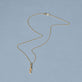 Stone and Strand 14K Yellow Gold Salmon Brunch Necklace Editorial Image