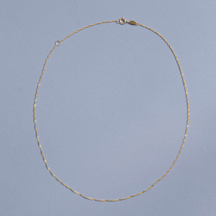 Stone and Strand 10K Yellow Gold Singapore Chain Editorial Image