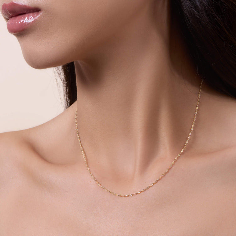 Image of 10K Yellow Gold Singapore Chain on Models Neck