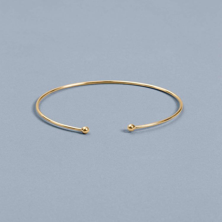 Stone and Strand 10K Yellow Gold Golden Ball Cuff Editorial Image