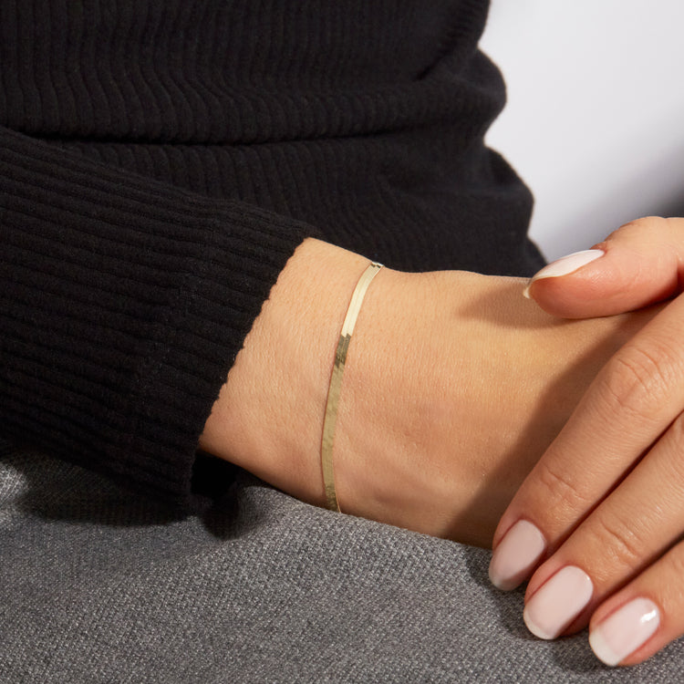 Image of 10K Yellow Gold Golden Glow Herringbone Bracelet on Models Arm