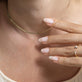 Model wearing Fine Nailed It Pave Diamond Ring with solid gold Stone and Strand jewelry