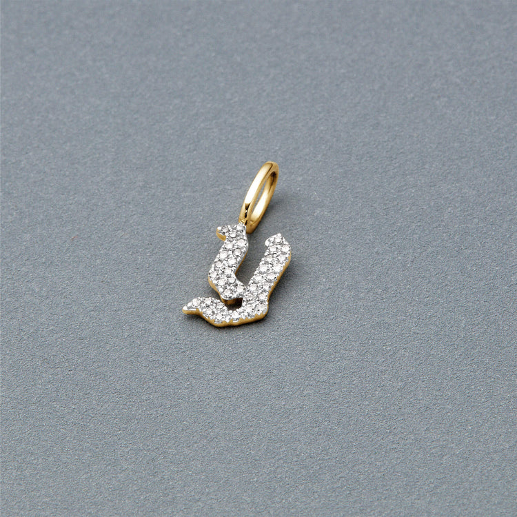 Stone and Strand 14K Yellow Gold Gothic Pave Initial Charm Editorial Image