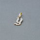 Stone and Strand 14K Yellow Gold Gothic Pave Initial Charm Editorial Image