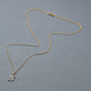 Stone and Strand 14K Yellow Gold Gothic Pave Initial Necklace Editorial Image