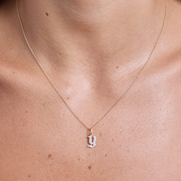 Image of 14K Yellow Gold Gothic Pave Initial Necklace on Models Neck