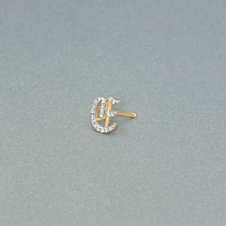 Stone and Strand 14K Yellow Gold Gothic Pave Initial Stud Editorial Image