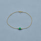 Stone and Strand 10K Yellow Gold Green Goddess Emerald Bracelet Editorial Image