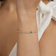Image of 14K Yellow Gold Green Goddess Tennis Bracelet with Emerald and White Sapphire on Models Arm