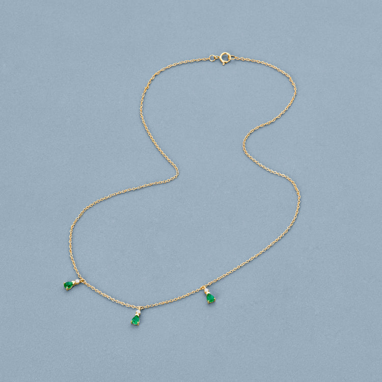 Stone and Strand 10K Yellow Gold Green Goddess Trio Emerald Necklace Editorial Image