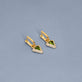 Stone and Strand 14K Yellow Gold Green Tourmaline Diamond Power Huggies Editorial Image