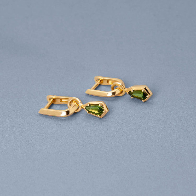 Stone and Strand 14K Yellow Gold Green Tourmaline Knife Edge Shield Drop Huggies Editorial Image