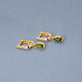 Stone and Strand 14K Yellow Gold Green Tourmaline Knife Edge Shield Drop Huggies Editorial Image