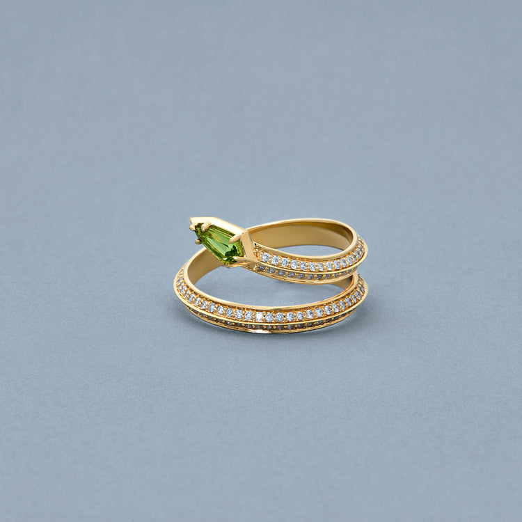 Stone and Strand 14K Yellow Gold Green Tourmaline Shield Serpent Ring Editorial Image