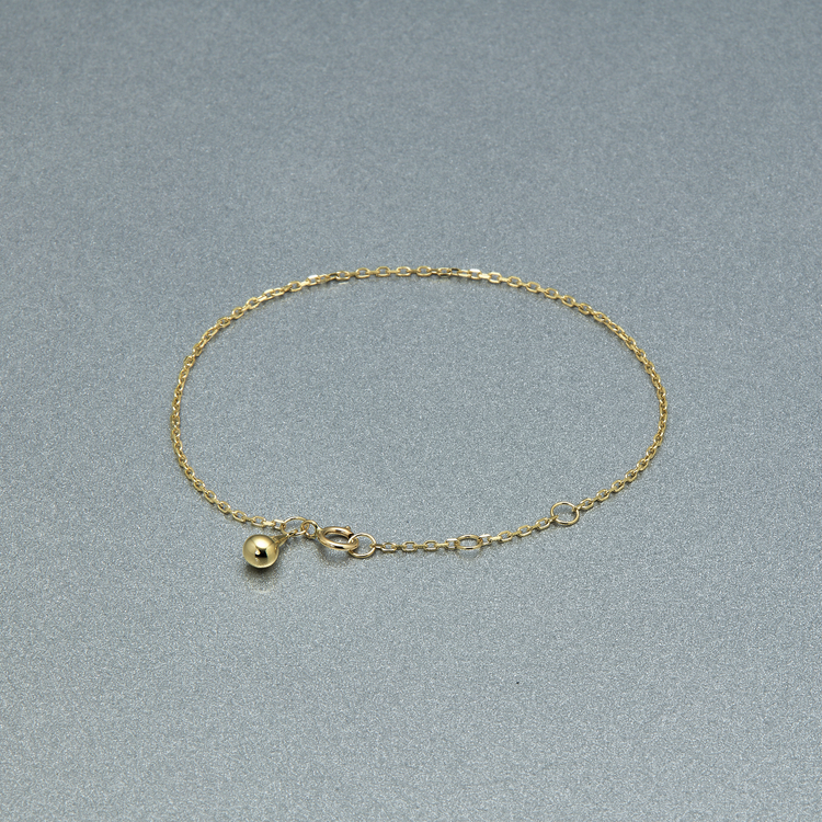 Stone and Strand 10K Yellow Gold Gold Drop Bracelet Editorial Image