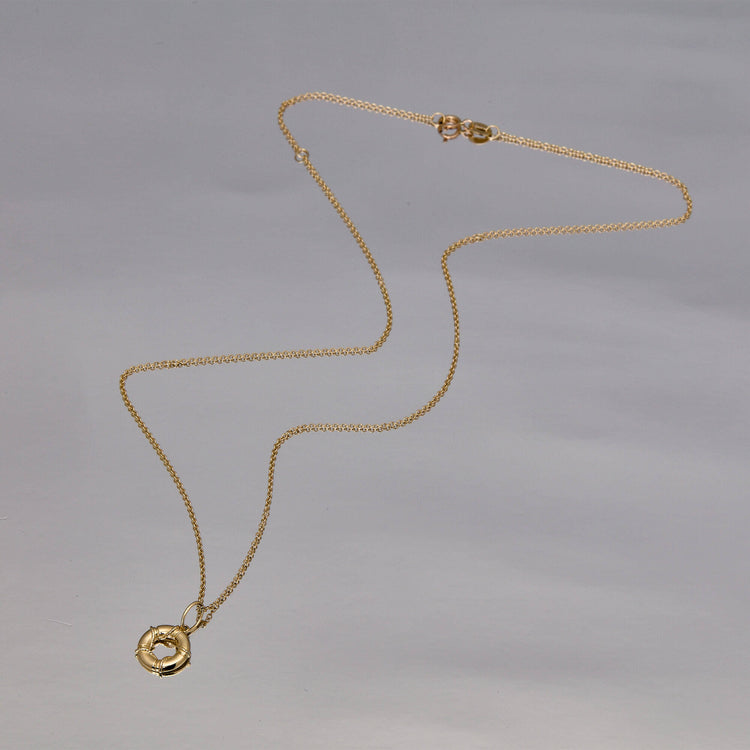 Stone and Strand 10K Yellow Gold Head Above The Water Necklace Editorial Image