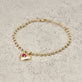 Stone and Strand 10K Yellow Gold Heart And Soul Ruby Bracelet Editorial Image