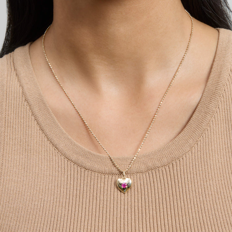 Image of 10K Yellow Gold Heart And Soul Ruby Necklace on Models Neck