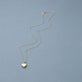 Stone and Strand 14K Yellow Gold Heart Essential Locket Charm Necklace Editorial Image