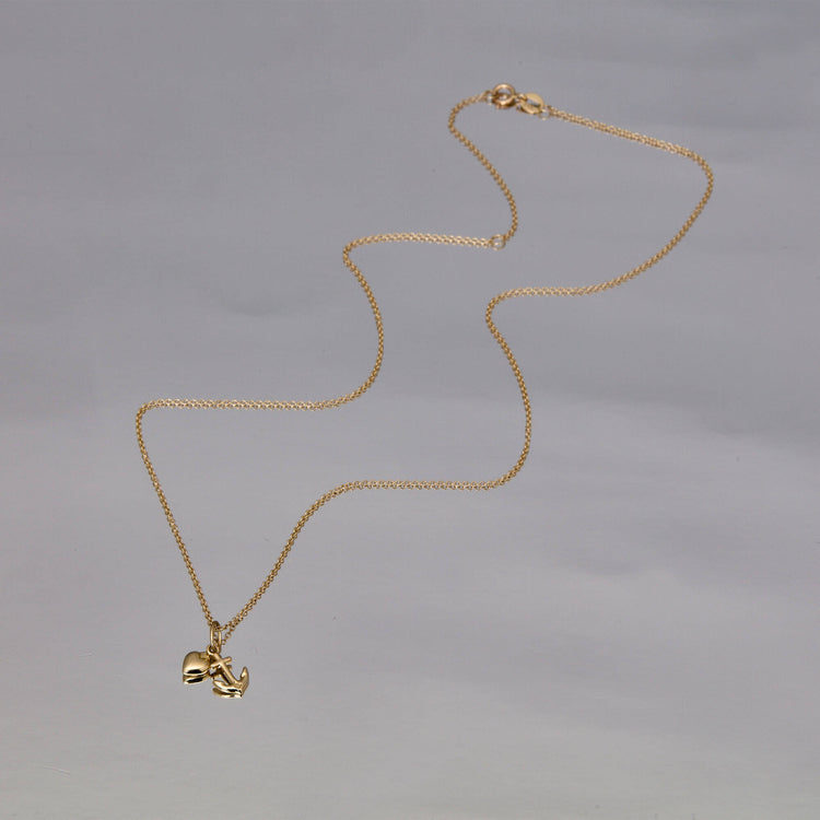 Stone and Strand 10K Yellow Gold Hope And Charity Necklace Editorial Image