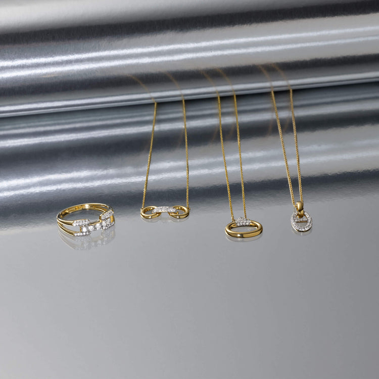 Still life image of Diamond Harness Ring with Stone and Strand solid gold jewelry