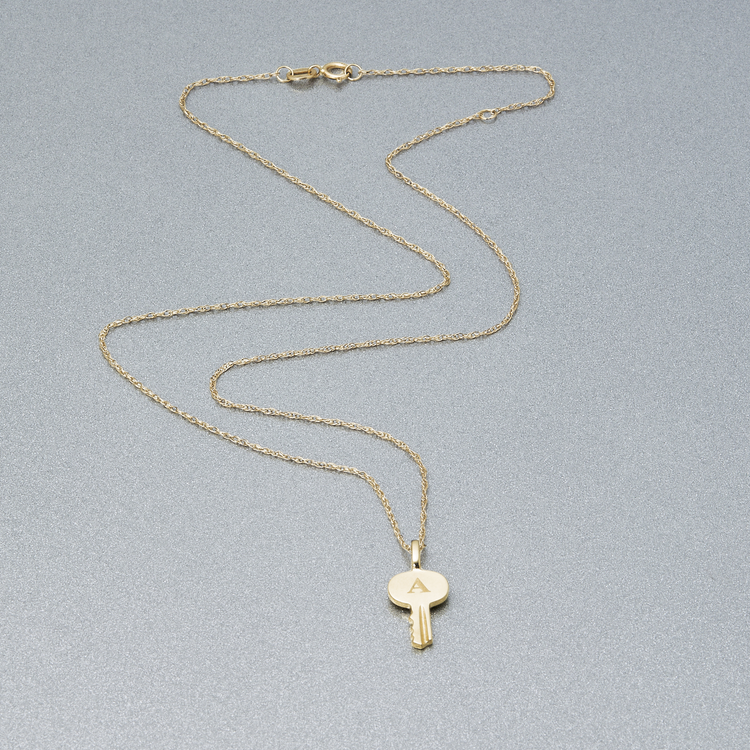 Stone and Strand 10K Yellow Gold Home Sweet Home Necklace Editorial Image