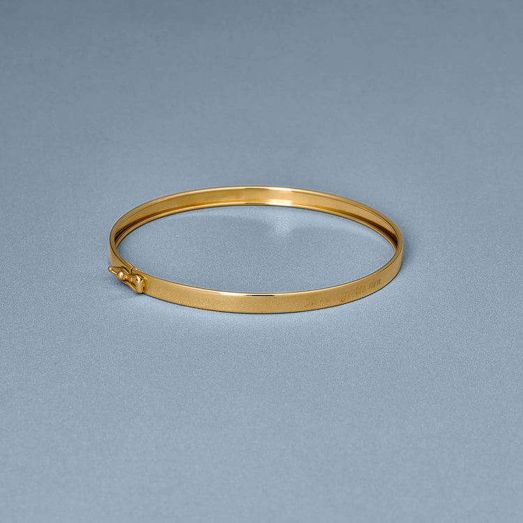 Stone and Strand 14K Yellow Gold Je Ne Regrette Gold Bangle Editorial Image