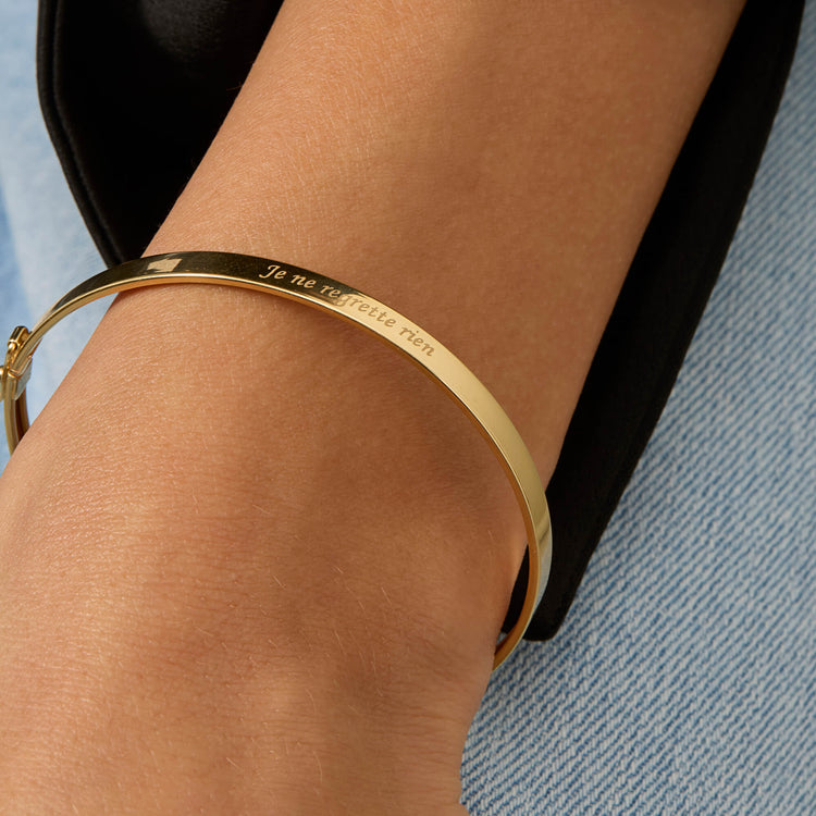 Image of 14K Yellow Gold Je Ne Regrette Gold Bangle on Models Arm