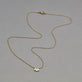 Stone and Strand 14K Yellow Gold Lab-Created Diamond Acrostic Mom Necklace Editorial Image