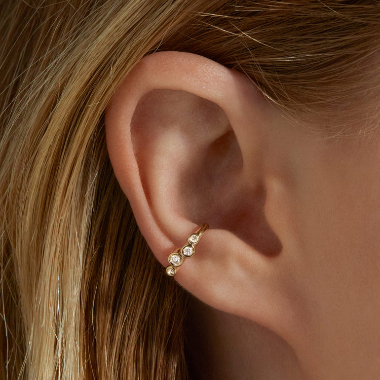 Image of 10K Yellow Gold Lab-Created Diamond Bubble Up Ear Cuff on Models Ear