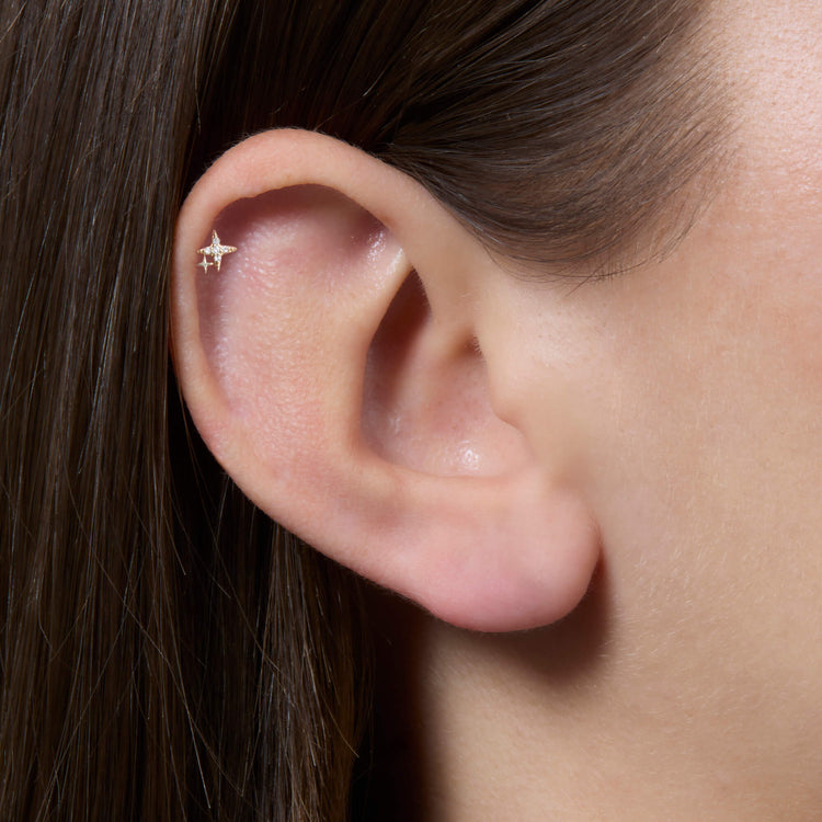 Image of 14K Yellow Gold LAB-Created Northern Star Flat Back Piercing Earring on Models Ear