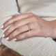 Image of 14K Yellow Gold LAB-Created Shared Prong Eternity Band on Models Hand