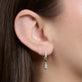Image of 14K Yellow Gold LAB-Created Shield Diamond Huggies on Models Ear