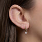Image of 14K Yellow Gold LAB-Created Shield Diamond Pave Huggies on Models Ear